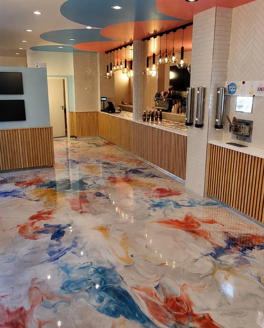 Colorful marbled epoxy floor in a commercial frozen yogurt shop