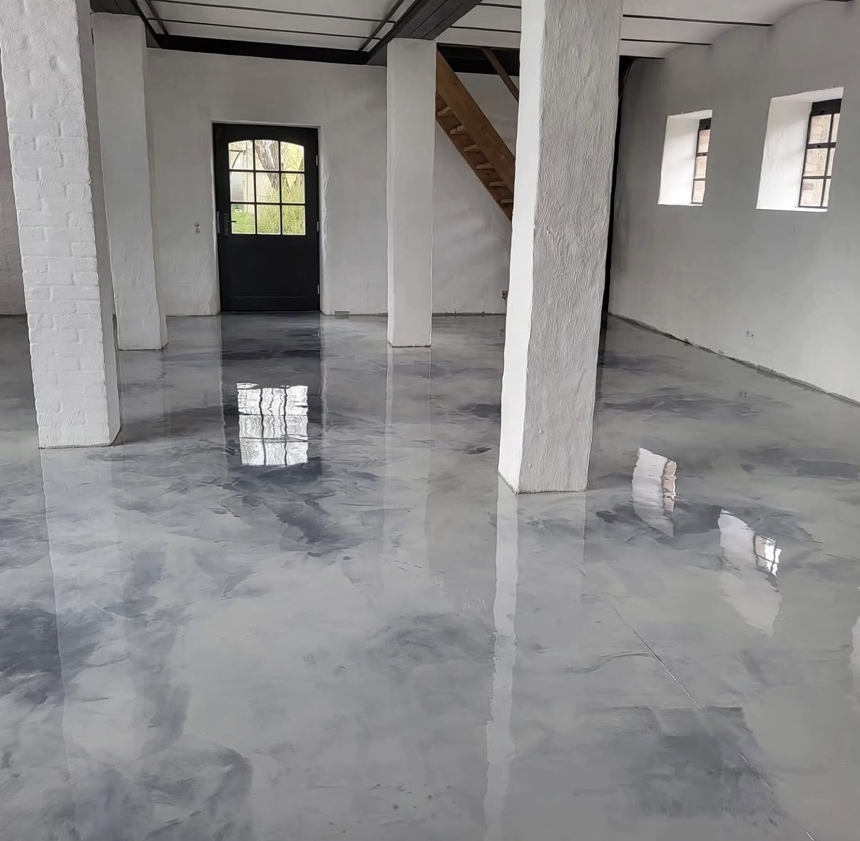 High-gloss metallic marble epoxy floor in a large commercial interior