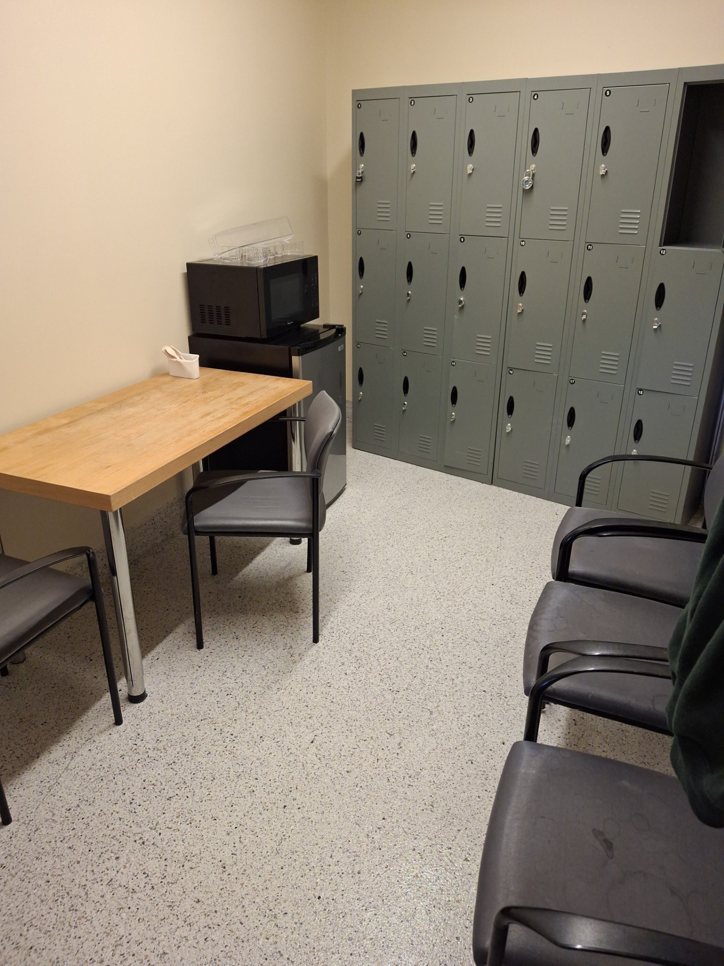 Decorative flake epoxy floor in a commercial locker room and break area